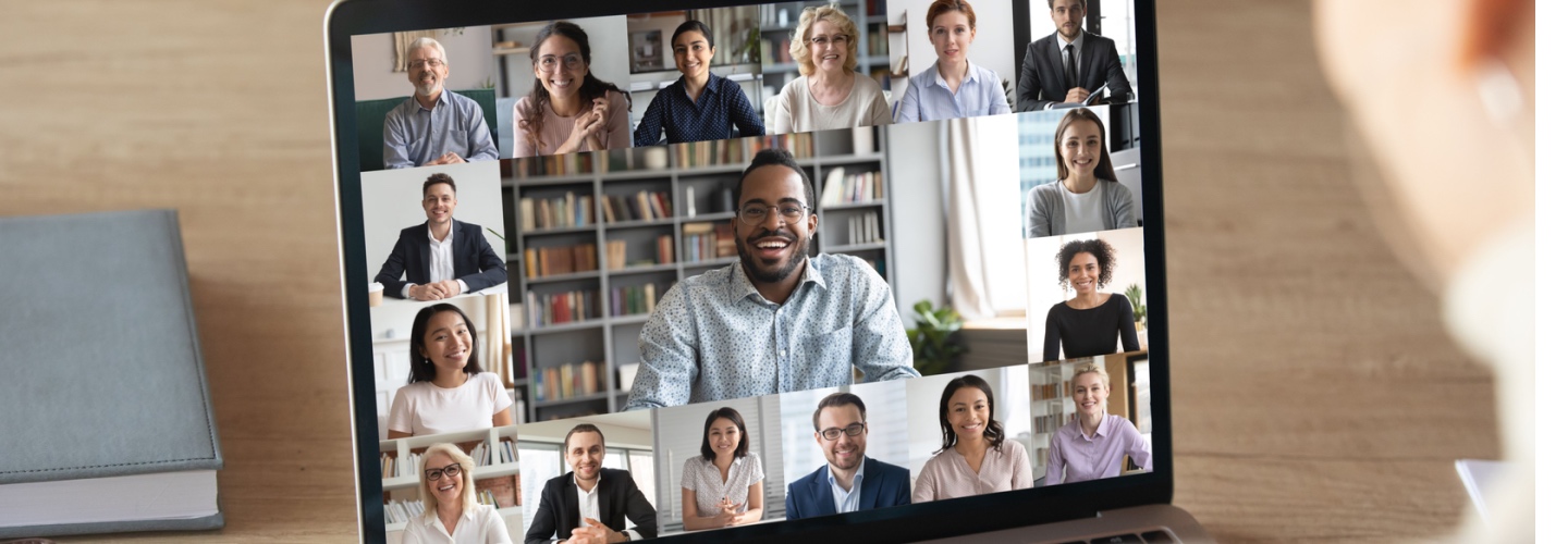 Back view of female employee speak talk on video call with diverse multiracial colleagues on online event briefing, woman worker have Webcam group conference with coworkers on modern laptop at home